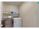 Laundry room with washer and dryer, offering functionality and ample storage at 5154 Bittercress Rd, Brighton, CO 80640