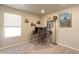 Efficient office space with large monitors, natural light, and decor at 5154 Bittercress Rd, Brighton, CO 80640