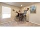 Functional home office with multiple monitors, wall decor and a bright window at 5154 Bittercress Rd, Brighton, CO 80640