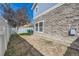 Cozy backyard featuring stone accents, small patch of grass, and privacy fence at 1133 S Richfield St, Aurora, CO 80017