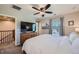 Bedroom with a ceiling fan, dresser, and artwork, creating a relaxing and stylish atmosphere at 1133 S Richfield St, Aurora, CO 80017