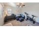 Office with a ceiling fan, desk, sitting area, and gym equipment, perfect for work and exercise at 1133 S Richfield St, Aurora, CO 80017