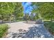 Outdoor common area featuring a shelter, picnic tables, and boulder seating surrounded by trees at 1133 S Richfield St, Aurora, CO 80017
