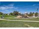 Playground area featuring play structures, grassy area, and blue skies at 1133 S Richfield St, Aurora, CO 80017
