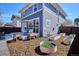 Backyard with a patio, an outdoor dining area, and raised garden beds, creating a serene outdoor space at 2801 Cherry St, Denver, CO 80207