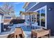 Backyard featuring an outdoor dining area, raised garden beds, and comfortable seating for outdoor relaxation and enjoyment at 2801 Cherry St, Denver, CO 80207