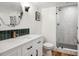 Clean bathroom with a glass shower and modern vanity at 2801 Cherry St, Denver, CO 80207