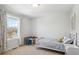 Bright bedroom with a single bed, playful decor, and a large window with a view of the outdoors at 2801 Cherry St, Denver, CO 80207