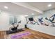 Home gym area with exercise bike, weights, and yoga mat at 2801 Cherry St, Denver, CO 80207