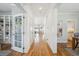 Bright hallway with wood floors connecting the main living spaces at 2801 Cherry St, Denver, CO 80207