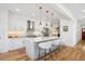 Well-lit kitchen with a spacious island, stainless steel appliances, and ample counter space at 2801 Cherry St, Denver, CO 80207