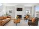 Cozy living room features a fireplace, comfortable seating, and natural light at 2801 Cherry St, Denver, CO 80207