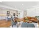 Spacious living room area adjacent to a modern kitchen with an open floor plan at 2801 Cherry St, Denver, CO 80207