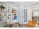 Cozy office space with built in shelves and a view to the dining room at 2801 Cherry St, Denver, CO 80207