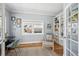 Office with chair, desk, built-in bookshelves, natural light, and hardwood floors at 2801 Cherry St, Denver, CO 80207