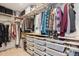 Organized walk-in closet with shelving, hanging racks, and storage baskets at 2801 Cherry St, Denver, CO 80207