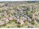 Panoramic aerial view of a residential neighborhood with lush greenery and winding streets at 23965 E Kettle Pl, Aurora, CO 80016