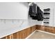 Walk-in closet with wood paneling, shelves, and hanging racks at 23965 E Kettle Pl, Aurora, CO 80016