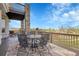 Outdoor deck features a dining table with views at 23965 E Kettle Pl, Aurora, CO 80016
