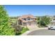 Beautiful home exterior with lush landscaping, mature trees, and well manicured lawn at 23965 E Kettle Pl, Aurora, CO 80016