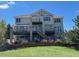 Multi-story home with a backyard view and multiple decks with a well maintained backyard at 23965 E Kettle Pl, Aurora, CO 80016
