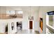 Two-story foyer with an elegant chandelier and views of the second level at 23965 E Kettle Pl, Aurora, CO 80016