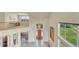 Spacious front entry featuring soaring ceilings, tile flooring, and a view of the second story at 23965 E Kettle Pl, Aurora, CO 80016