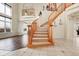 Grand foyer with a curved staircase, tile flooring, and a balcony overlooking the entryway at 23965 E Kettle Pl, Aurora, CO 80016
