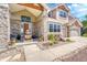 Charming stone-accented facade with meticulously landscaped front yard and relaxing water feature at 23965 E Kettle Pl, Aurora, CO 80016