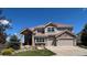 Beautiful two-story home featuring a well-manicured lawn and an attached two car garage at 23965 E Kettle Pl, Aurora, CO 80016