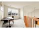 Upstairs hallway with a workstation and a large window at 23965 E Kettle Pl, Aurora, CO 80016