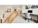 Hallway featuring a staircase, desk, artwork, and carpet floors at 23965 E Kettle Pl, Aurora, CO 80016