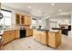 Open kitchen featuring granite countertops, stainless appliances, and a view to the living room at 23965 E Kettle Pl, Aurora, CO 80016