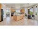 Open kitchen with a center island, stainless appliances, and a breakfast nook at 23965 E Kettle Pl, Aurora, CO 80016