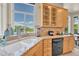 Well-equipped kitchen with granite countertops, sink, and window views at 23965 E Kettle Pl, Aurora, CO 80016