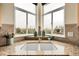 Close-up of a kitchen sink with granite countertops and a corner window with view at 23965 E Kettle Pl, Aurora, CO 80016