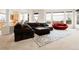 Open-concept living room with bright light, sleek furniture and plush carpet at 23965 E Kettle Pl, Aurora, CO 80016