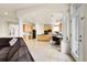 Bright open-concept space with kitchen and living areas separated by a large decorative column at 23965 E Kettle Pl, Aurora, CO 80016