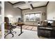 Cozy home office with a large window, comfortable couch, and a modern desk setup at 23965 E Kettle Pl, Aurora, CO 80016