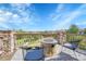 Outdoor patio with stone fire pit and seating; great for relaxing and enjoying the view at 23965 E Kettle Pl, Aurora, CO 80016