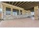 Covered patio with stone pillars and patterned concrete is perfect for outdoor entertaining at 23965 E Kettle Pl, Aurora, CO 80016
