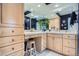 Bright bathroom with ample counter space, vanity, wooden stool, and cabinets for seamless storage solutions at 824 S Medea Way, Denver, CO 80209