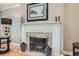 Cozy fireplace with a decorative mantel and mosaic tile surround at 824 S Medea Way, Denver, CO 80209