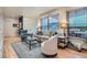 Bright living room with natural light, hardwood floors, and stylish seating at 824 S Medea Way, Denver, CO 80209