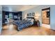 Spacious main bedroom features a large bed, ensuite bathroom, and seating area, creating a serene retreat at 824 S Medea Way, Denver, CO 80209