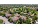 Aerial view of a neighborhood featuring lush trees, well-maintained properties and a community pond at 4070 S Atchison Way # 304, Aurora, CO 80014