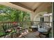 Inviting outdoor balcony with seating and scenic views of the surrounding foliage at 4070 S Atchison Way # 304, Aurora, CO 80014