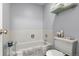 Well-maintained bathroom with a tub, toilet, and tiled walls at 4070 S Atchison Way # 304, Aurora, CO 80014