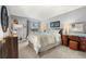 Relaxing bedroom featuring soft lighting, a cozy bed, and stylish decor at 4070 S Atchison Way # 304, Aurora, CO 80014