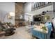 Bright living room features a stone fireplace and modern furnishings at 4070 S Atchison Way # 304, Aurora, CO 80014
